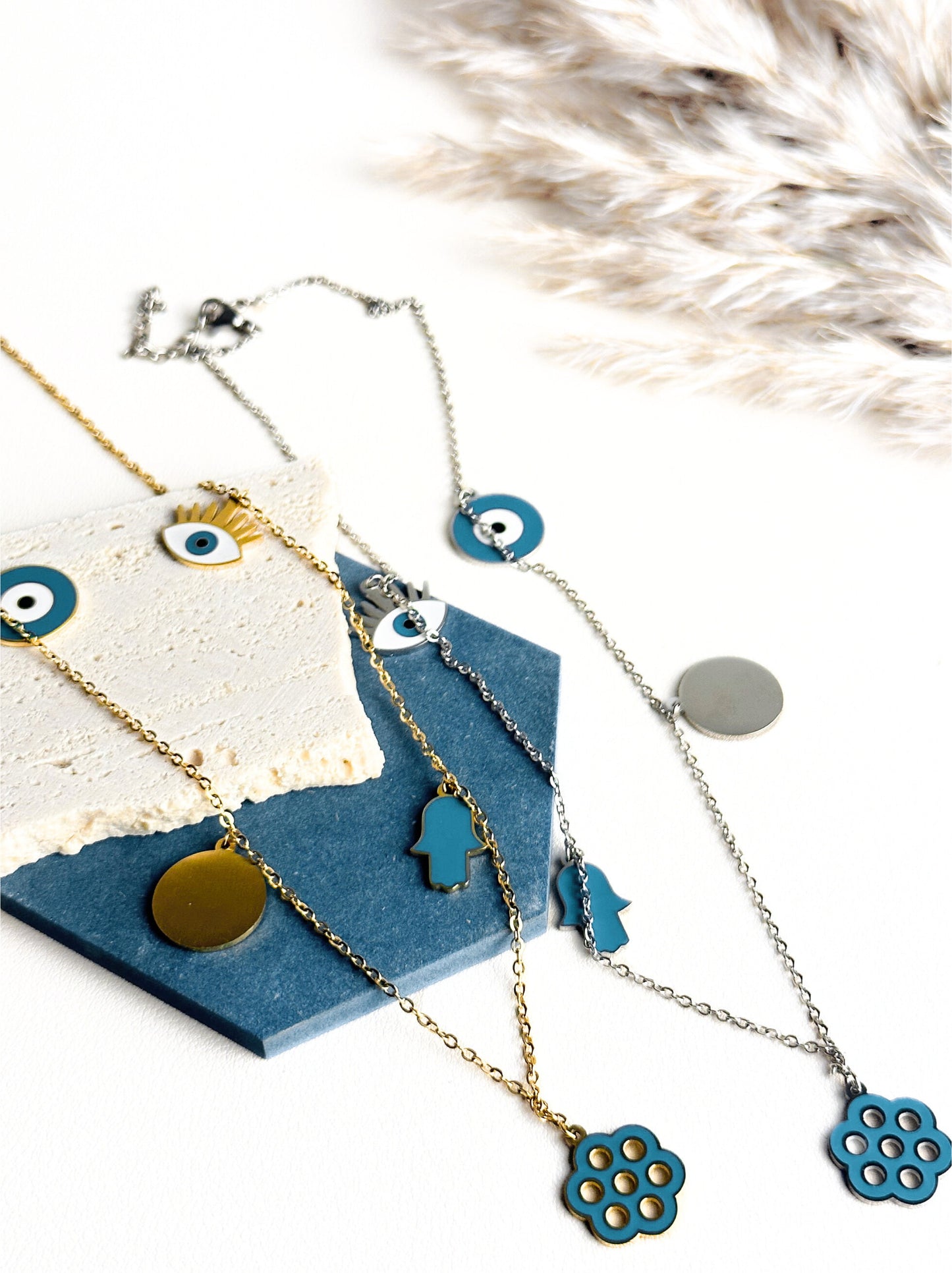 Colar de aço prateado mão de fátima e olho