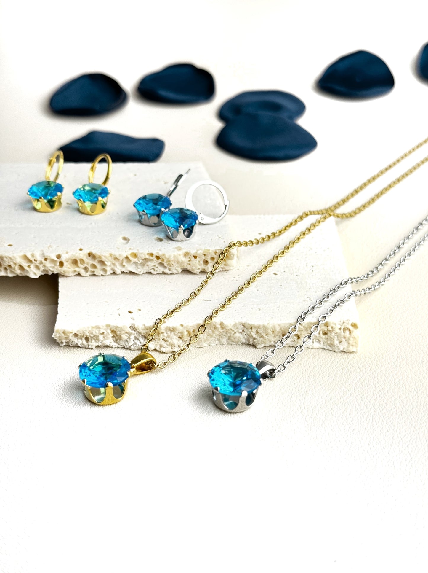 Golden steel necklace with blue crystal