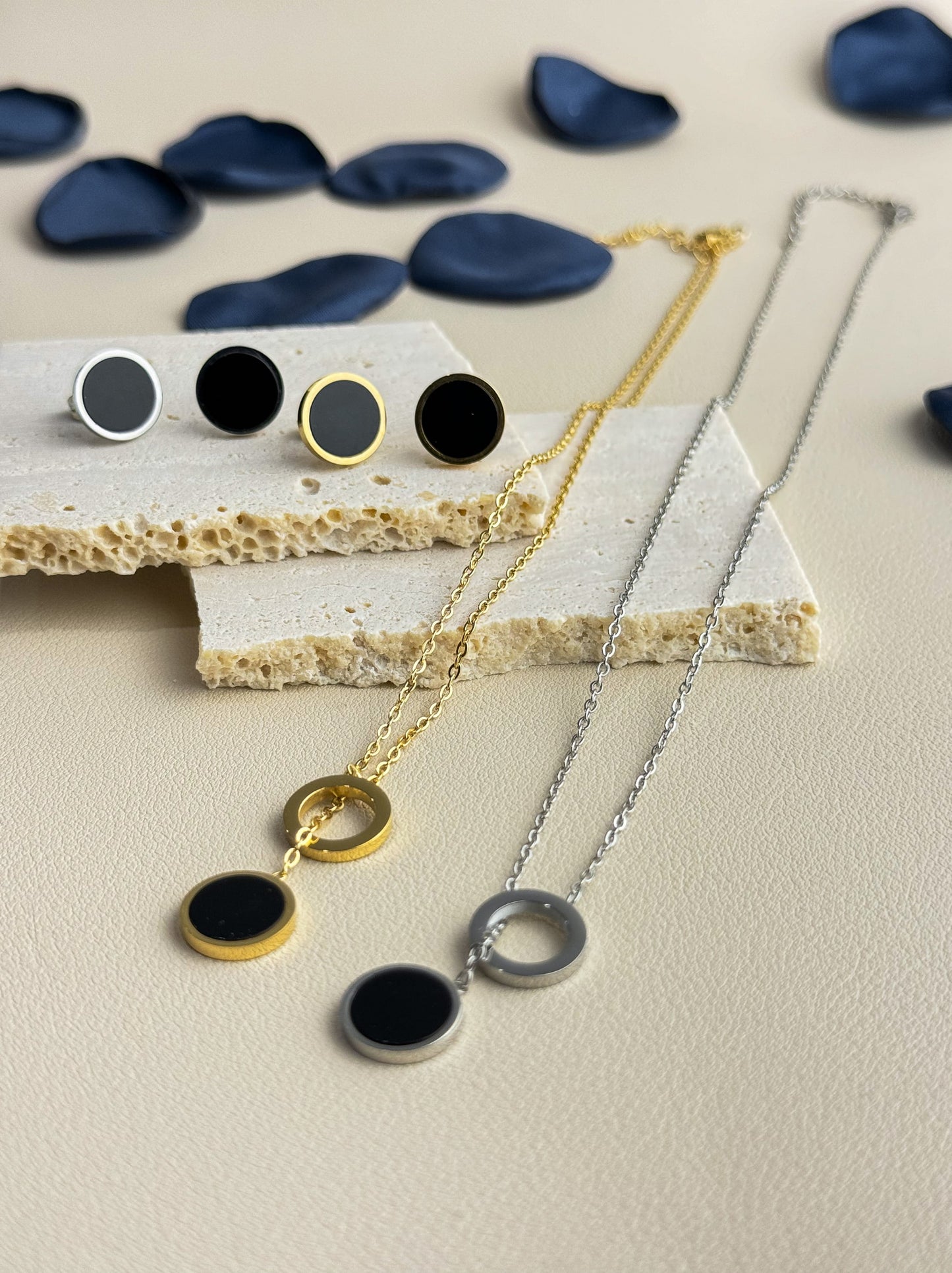 Silver steel necklace with black medal