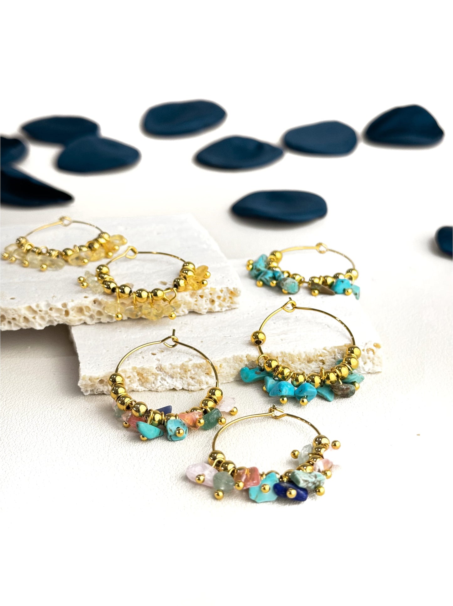 Golden steel rings with natural stones