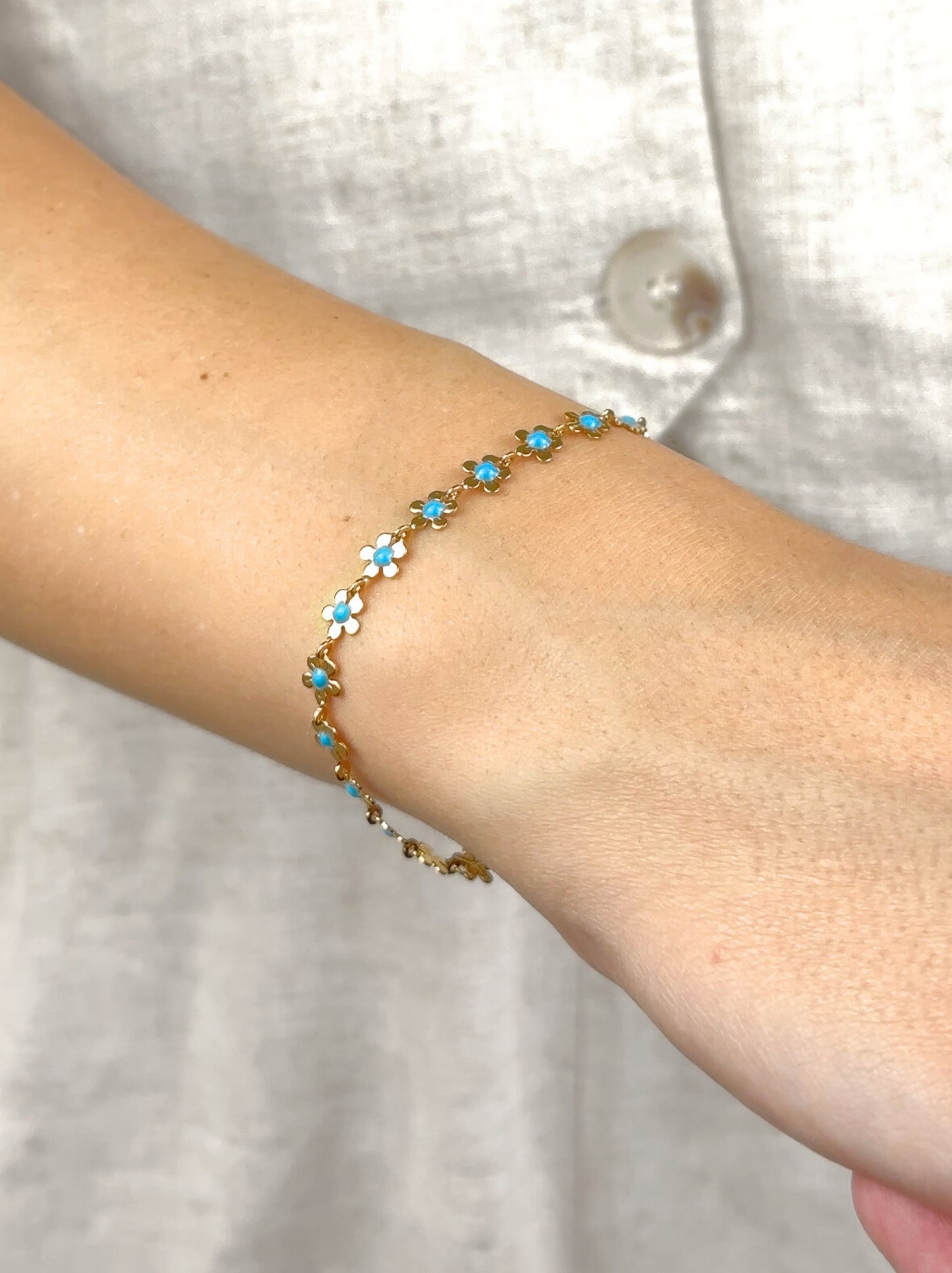 Bracelet acier doré fleur bleue