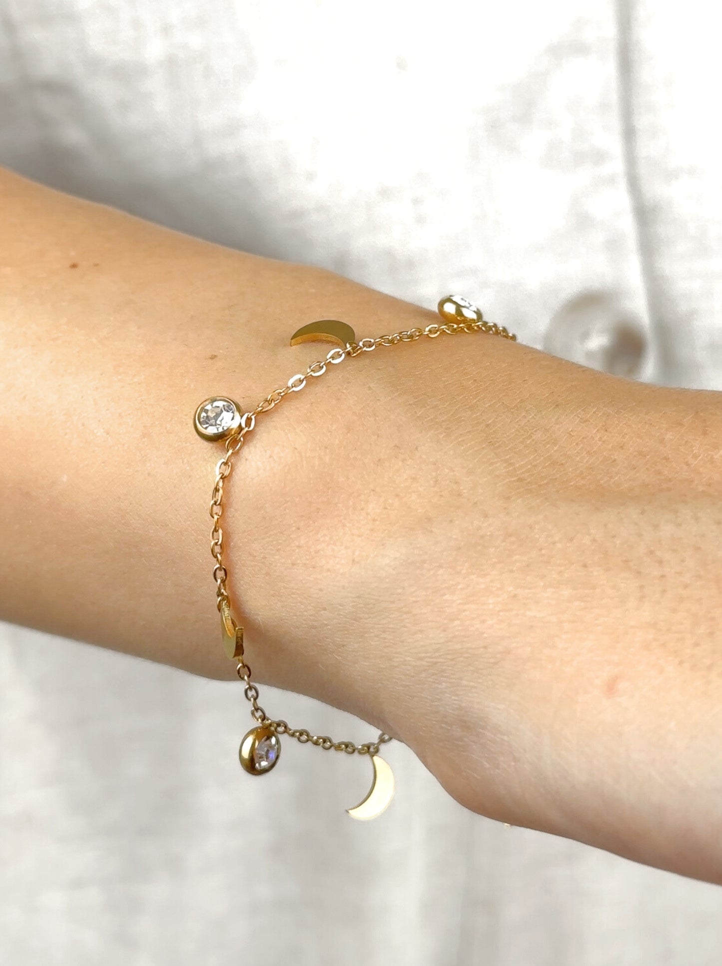 Moon and zirconia gold steel bracelet