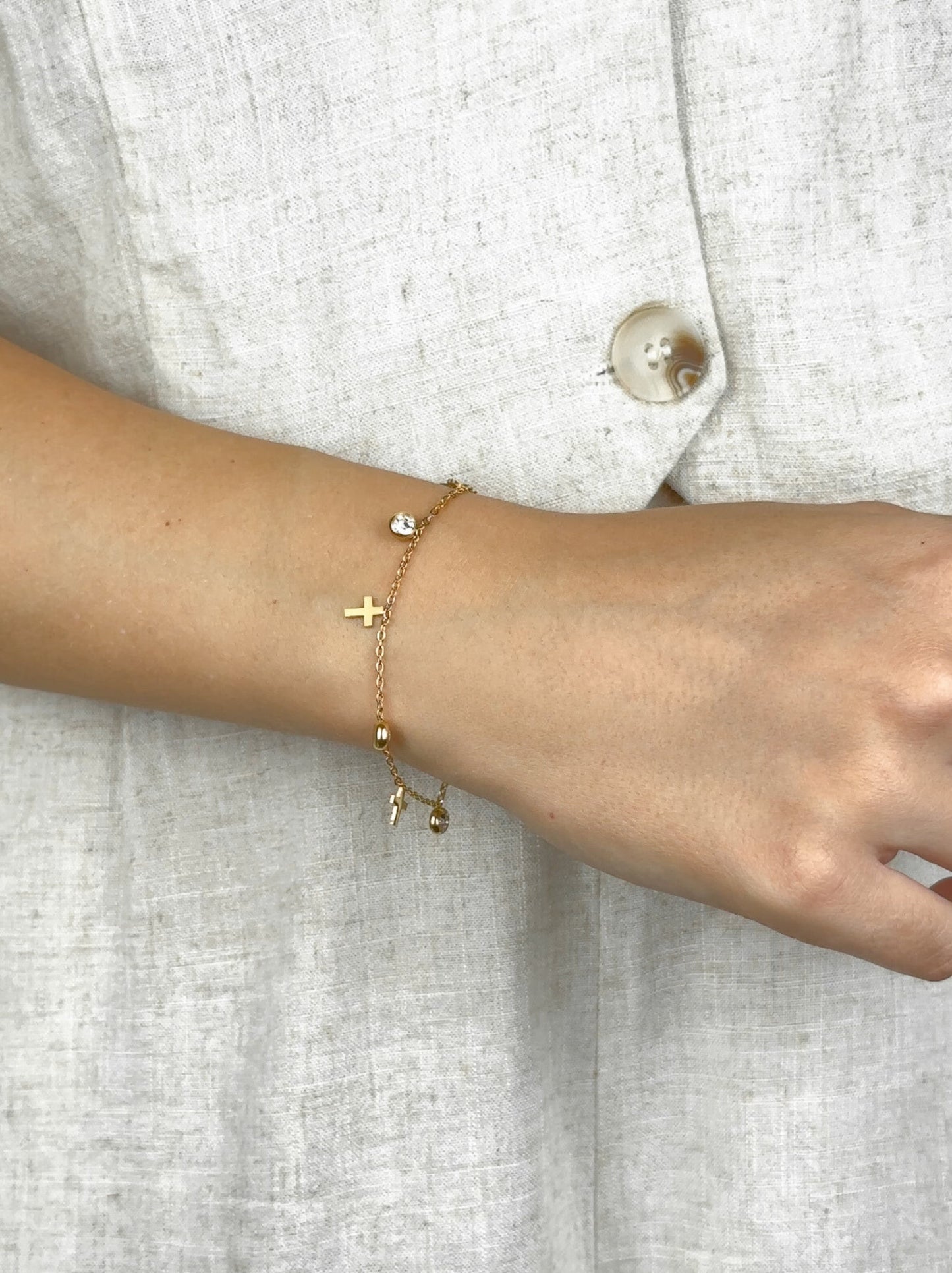 Golden cross and zirconia steel bracelet