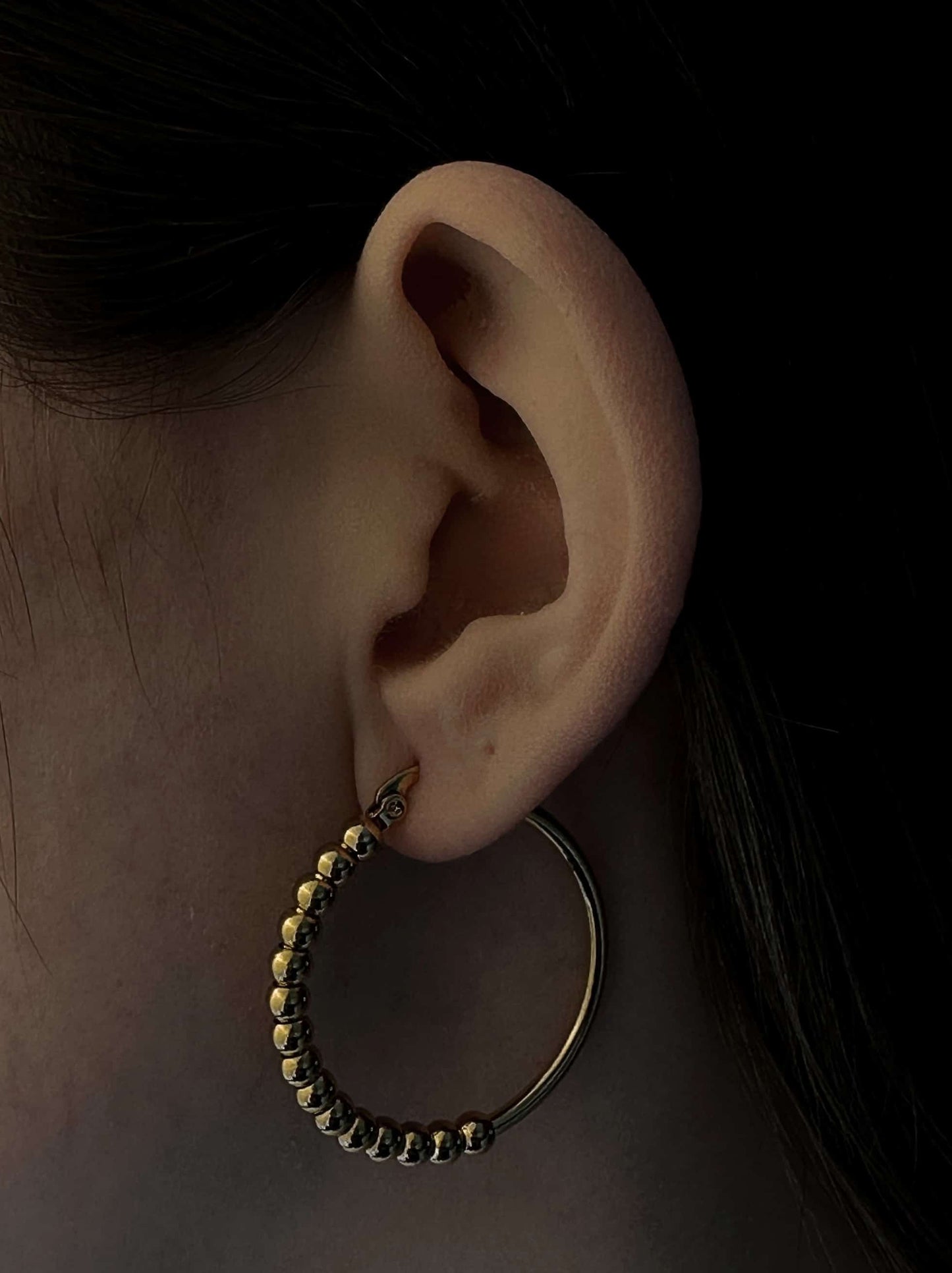 Golden steel hoops with polka dots