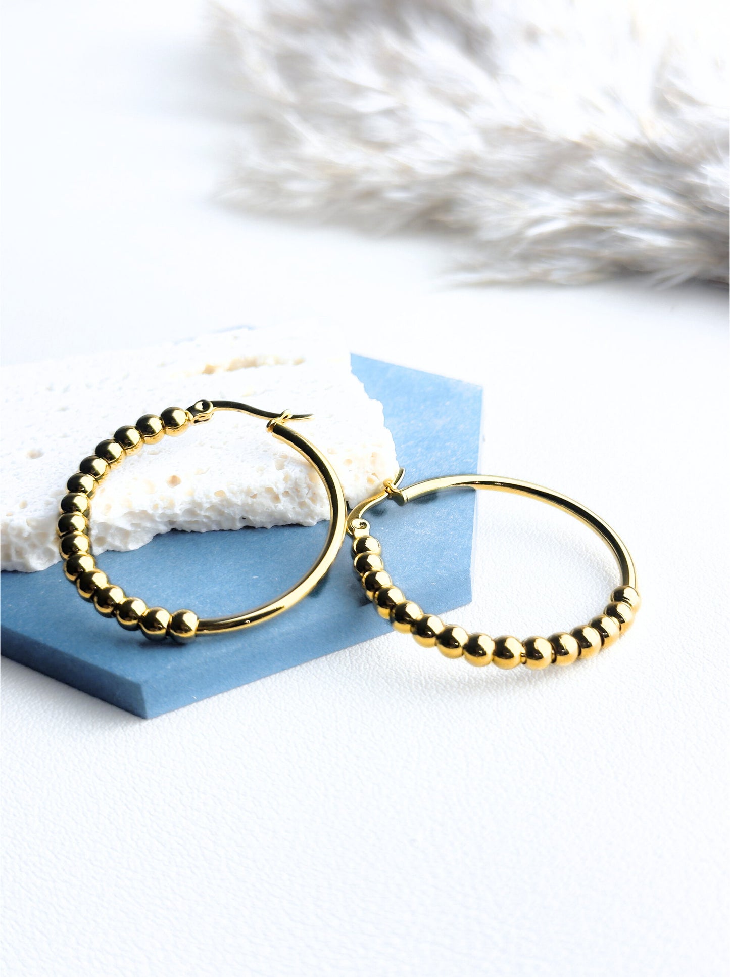 Golden steel hoops with polka dots