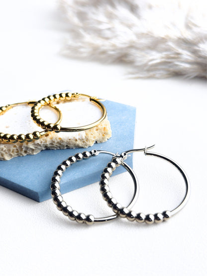 Golden steel hoops with polka dots