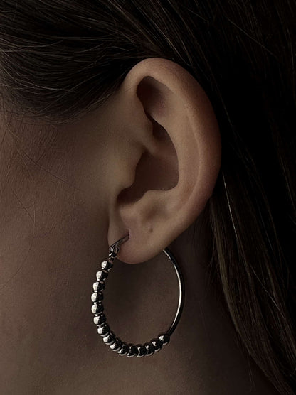 Silver steel hoops with polka dots