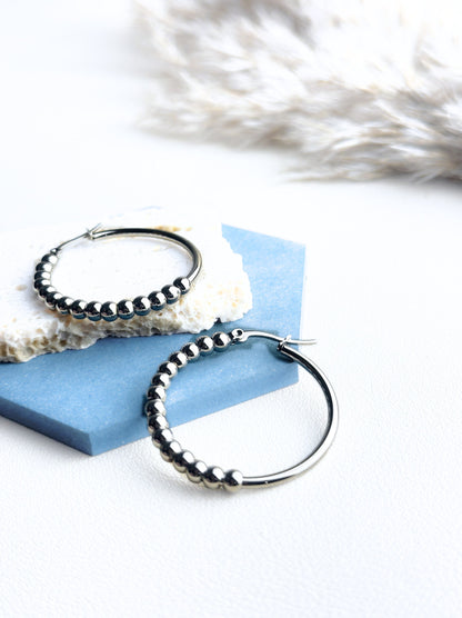 Silver steel hoops with polka dots