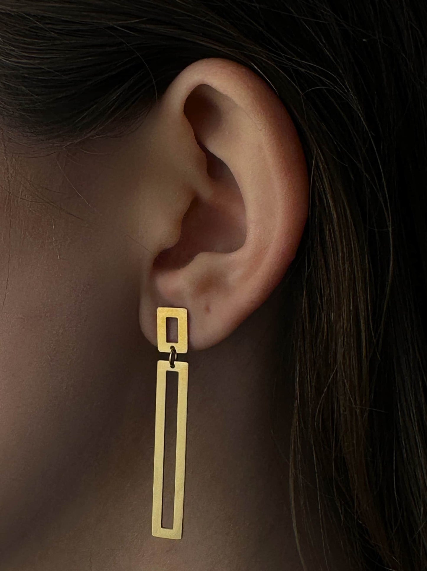 Long golden steel earrings