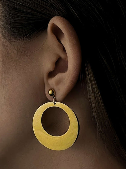 Oval golden steel earrings