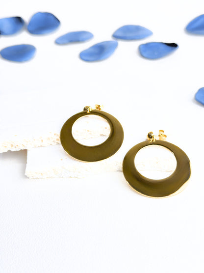 Oval golden steel earrings