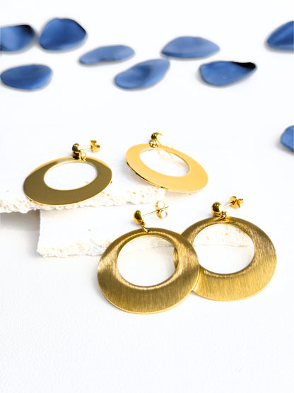 Oval golden steel earrings