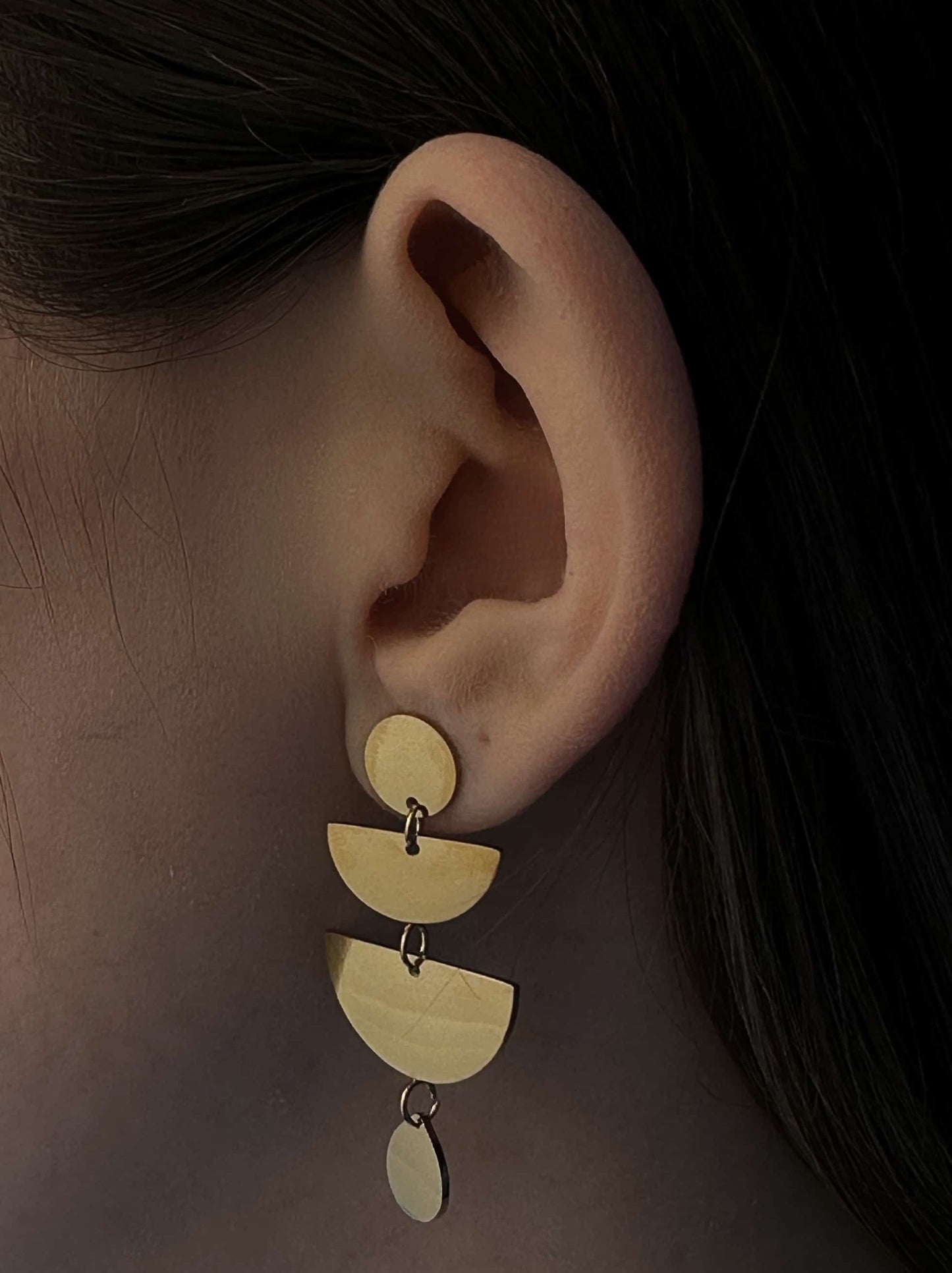 Long golden steel earrings