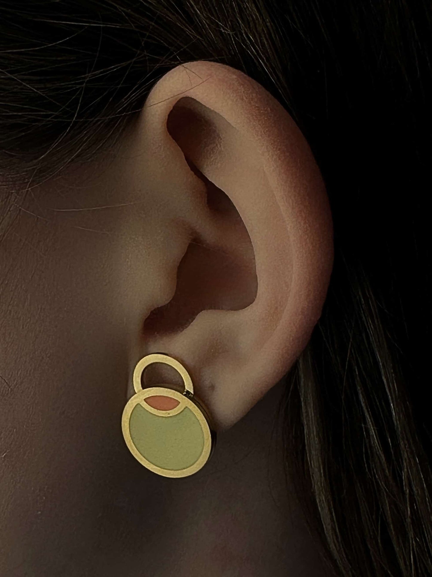 Golden steel enameled circle earrings