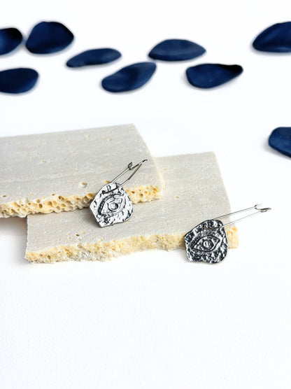 Irregular silver steel earrings with eye