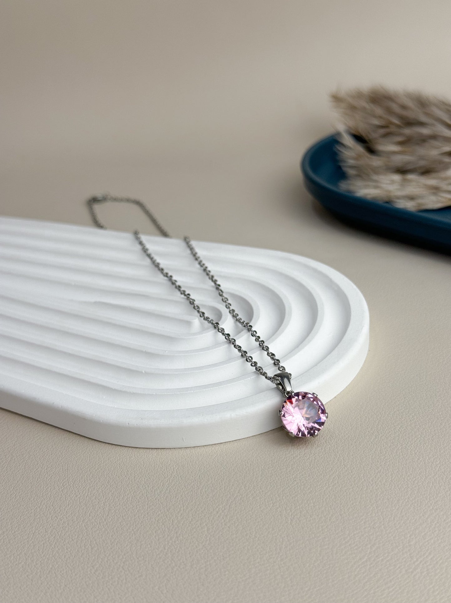 Silver steel necklace with pink crystal