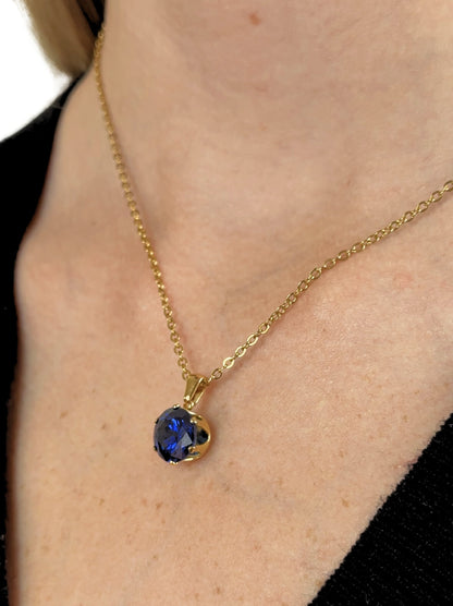 Collier acier doré cristal bleu