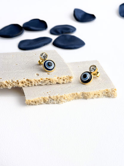 Golden steel earrings with eye