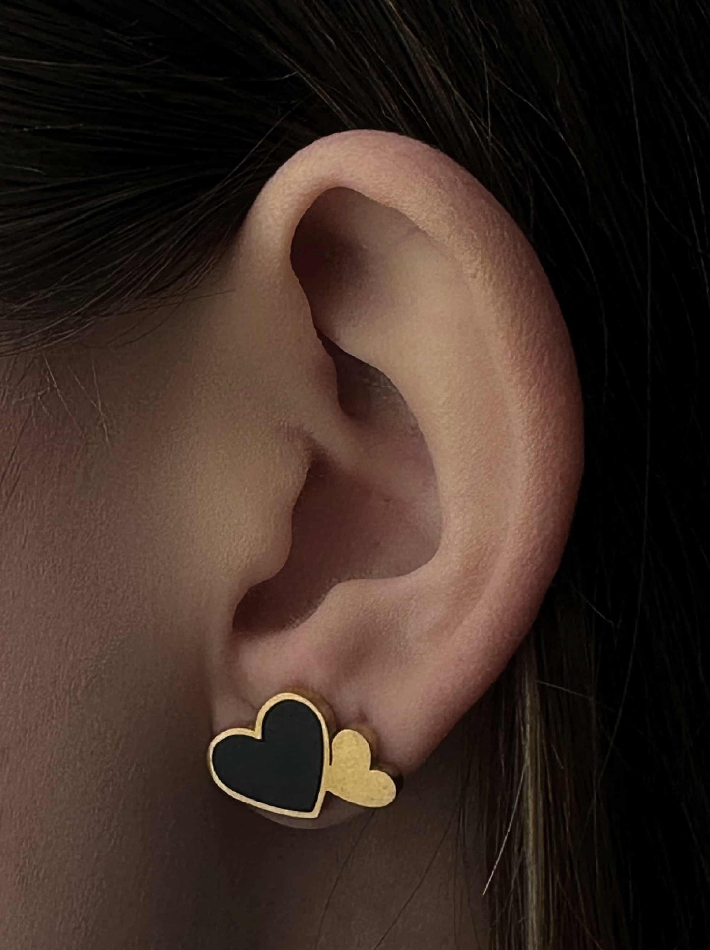 Golden steel earrings with black heart