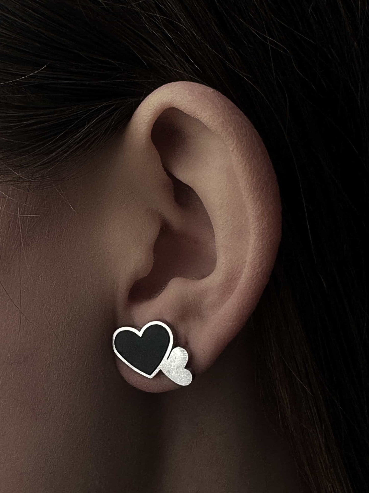 Silver steel earrings with black heart