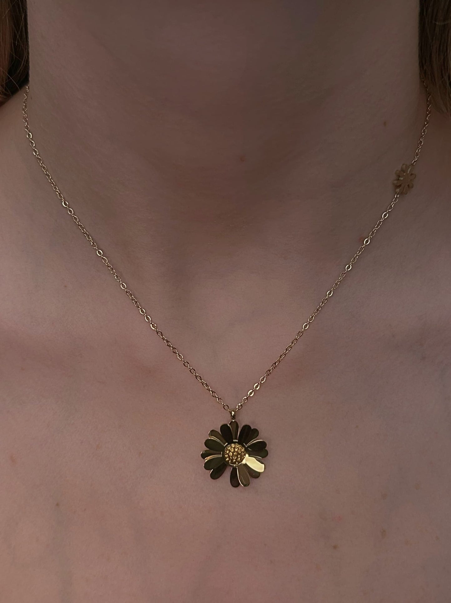 Golden steel necklace with flower