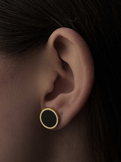 Golden steel earrings with black medal