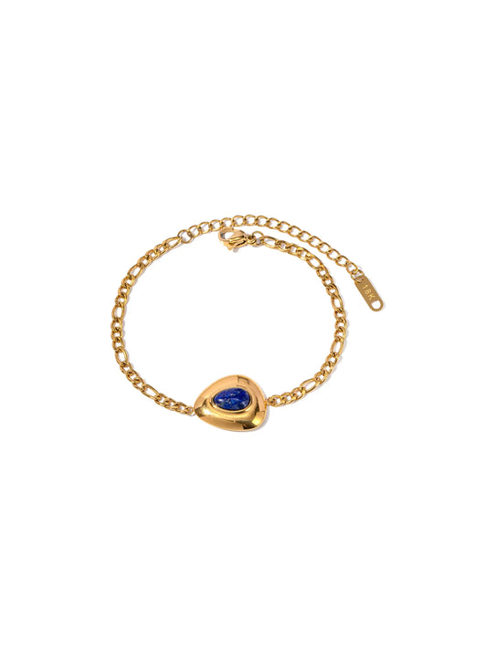 Golden steel bracelet with blue stone