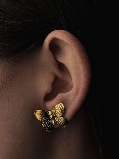 Boucle d'oreille papillon en acier doré