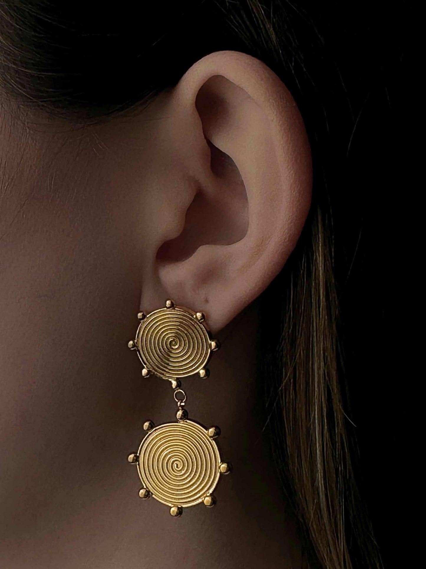 Spiral golden steel earrings