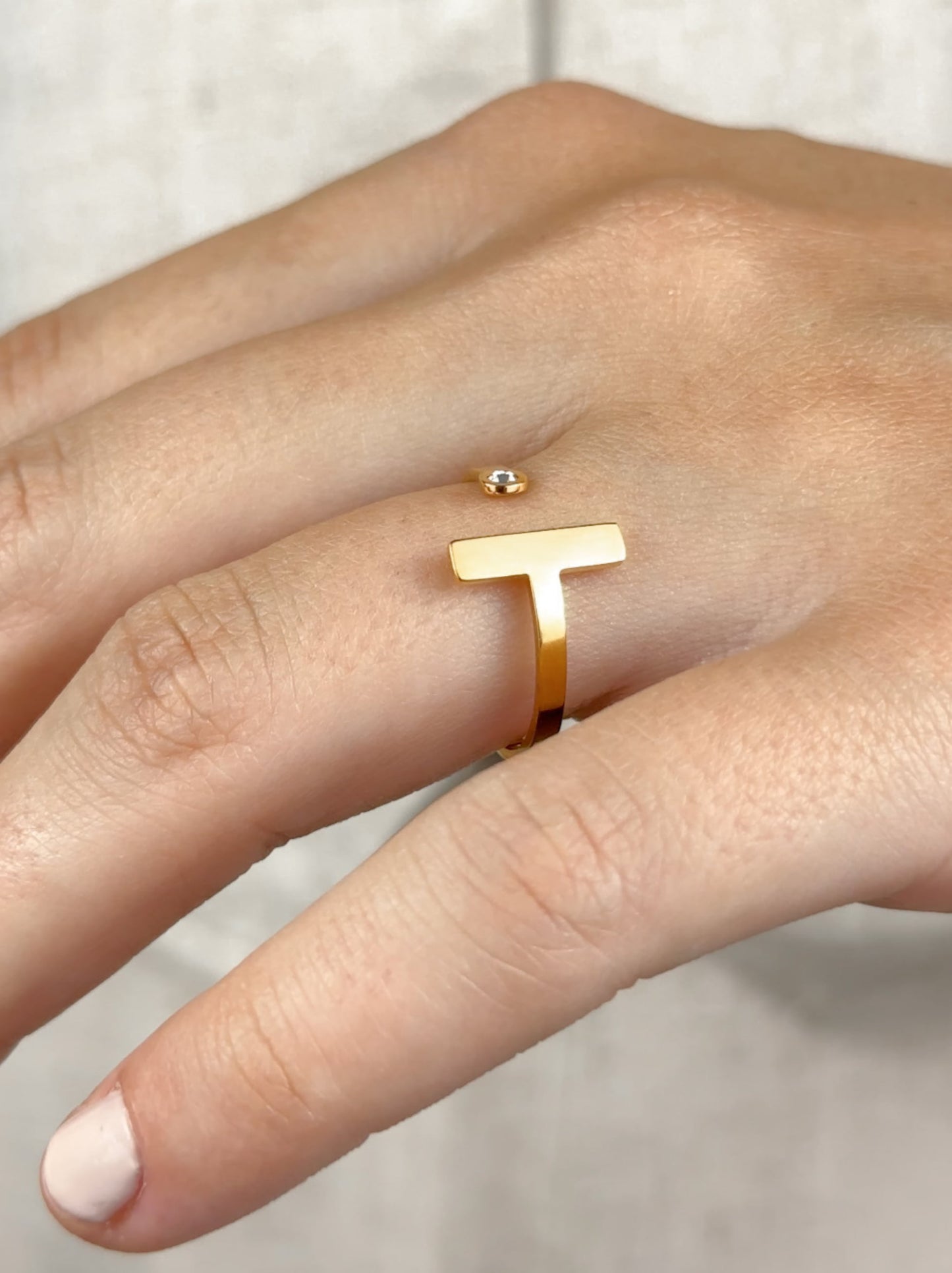 Adjustable gold steel ring with zirconia