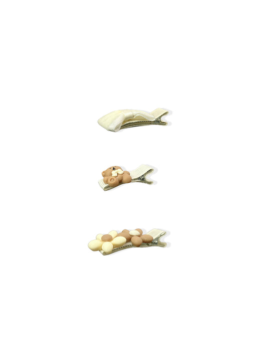 Set of beige hair clips with bear and flowers