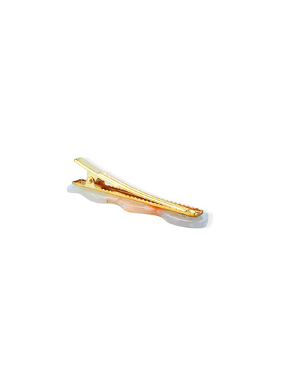 Golden hair clip with orange resin